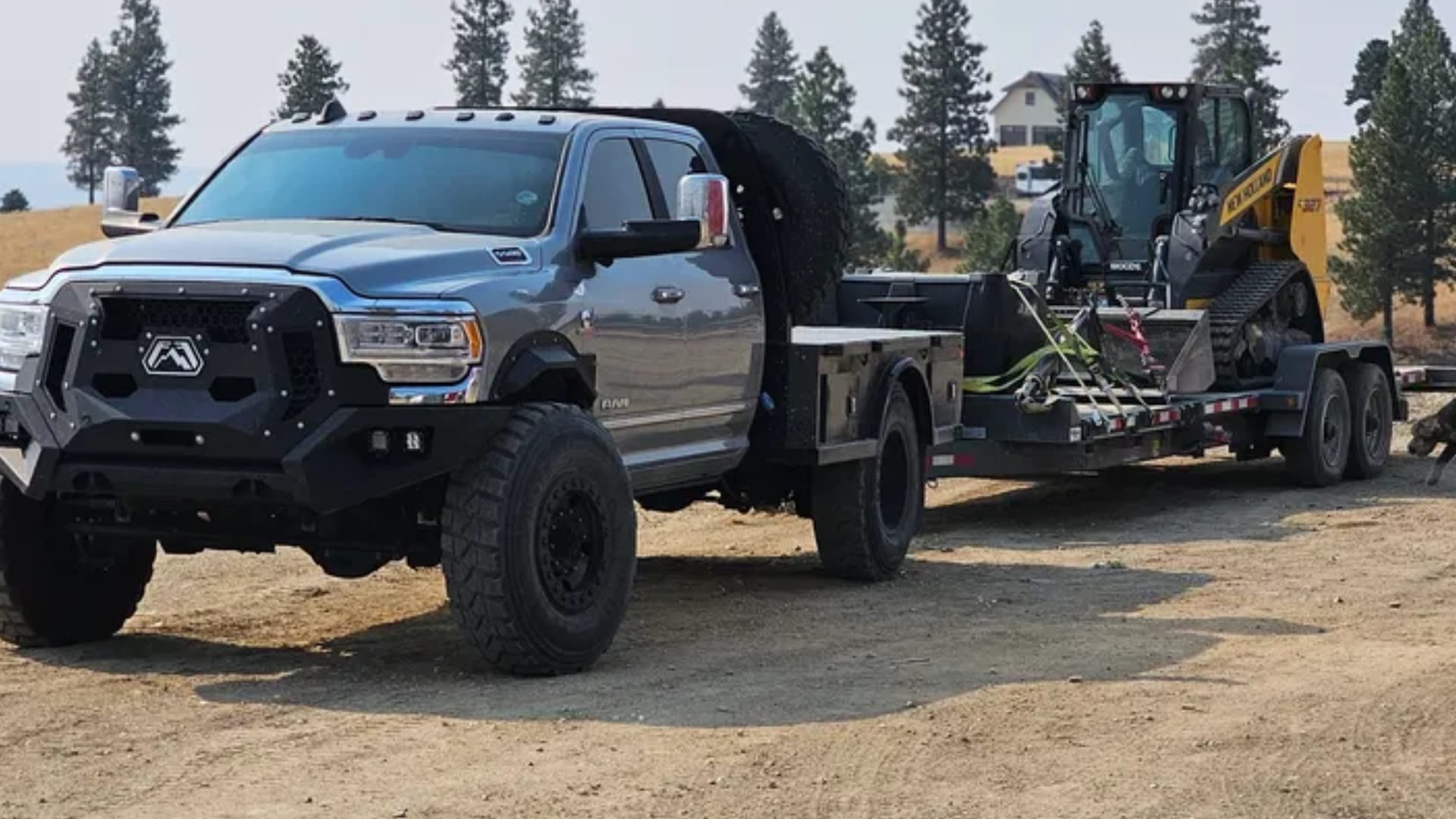 a truck hauling heavy equipment
