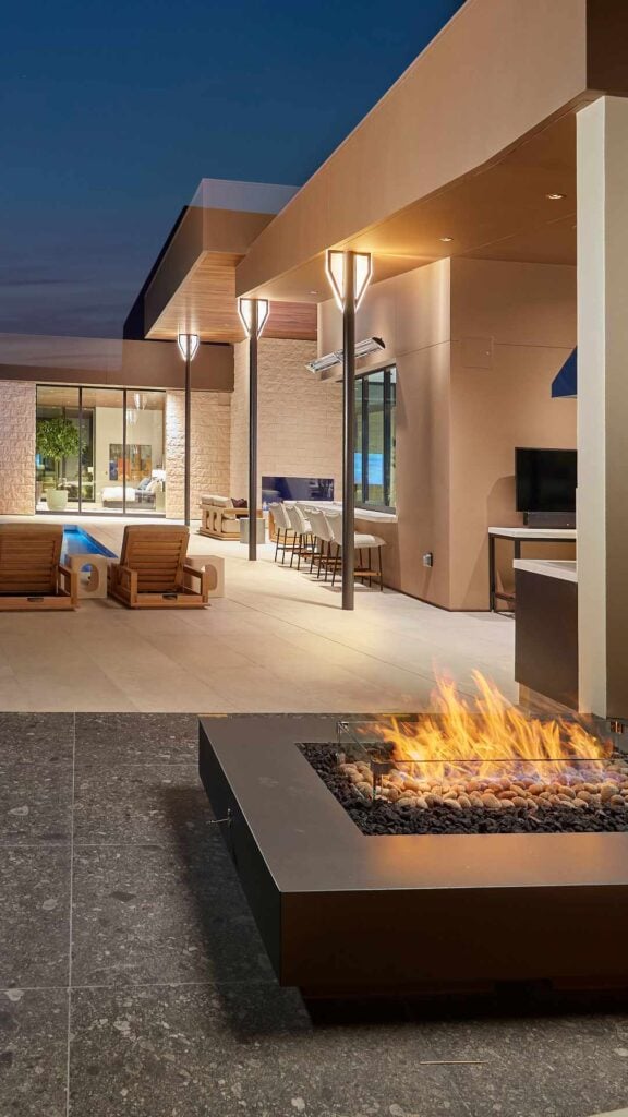 a modern home displaying a custom gas fire pit
