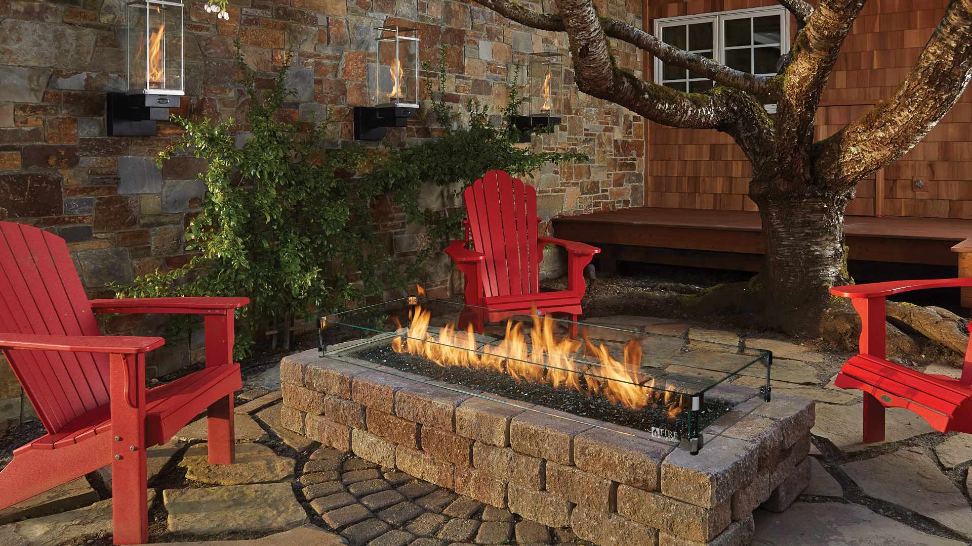 an outdoor seating area with custom fire pit