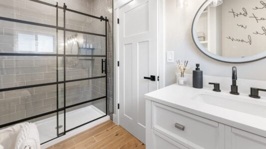 remodeled bathroom with new vanity and mirror