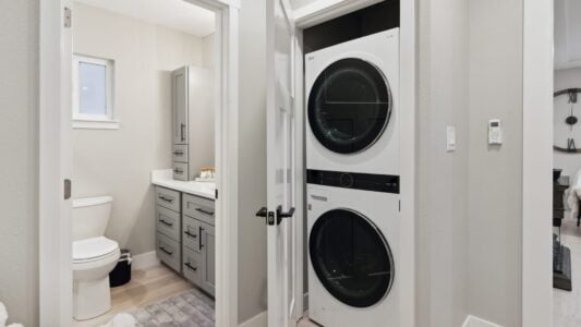 new bathroom with washer and dryer