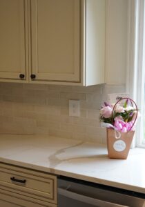 some flowers on a new kitchen countertop