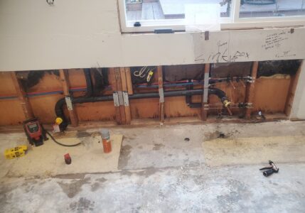 kitchen water pipes behind wall