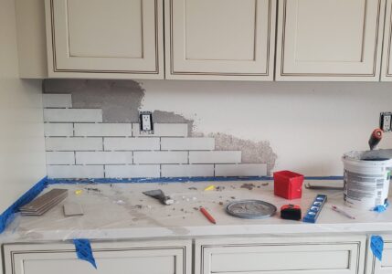 Beginning tile work during a kitchen remodel