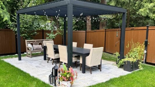 photo of an outdoor seating area with outdoor lighting and fancy chairs